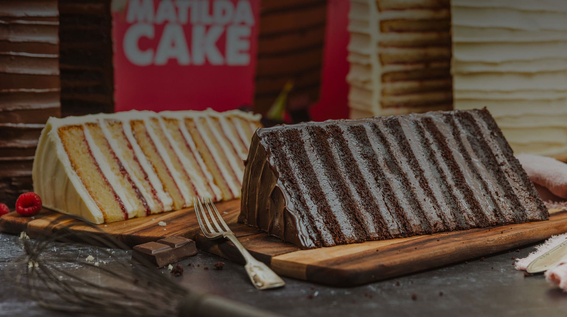 Layered cakes on a wooden board from the Studio Bakery campaign
