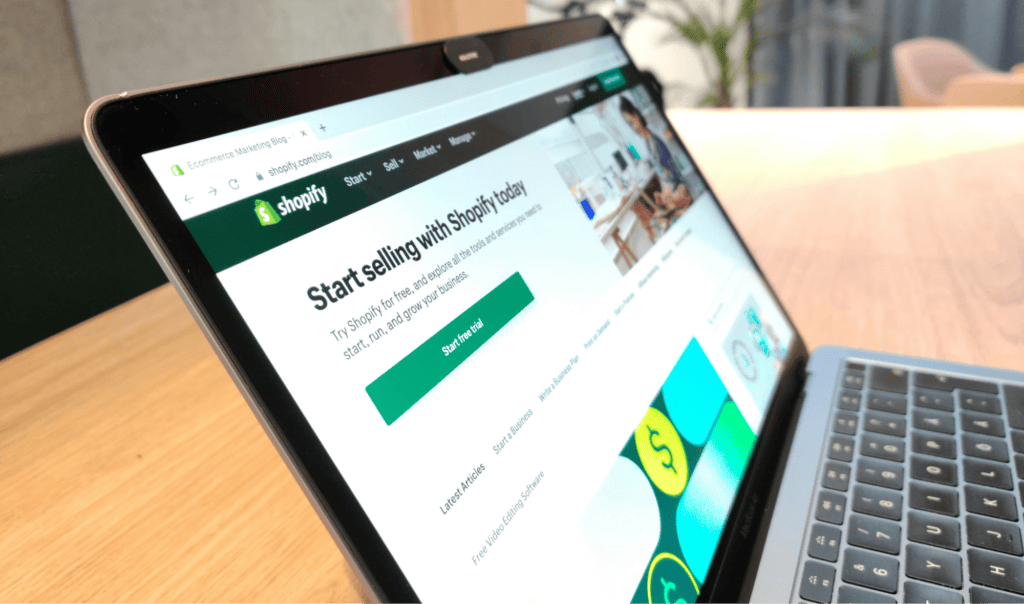Laptop displaying Shopify start selling page, showcasing web design services in Hull, Yorkshire, for businesses seeking professional website development and marketing solutions.