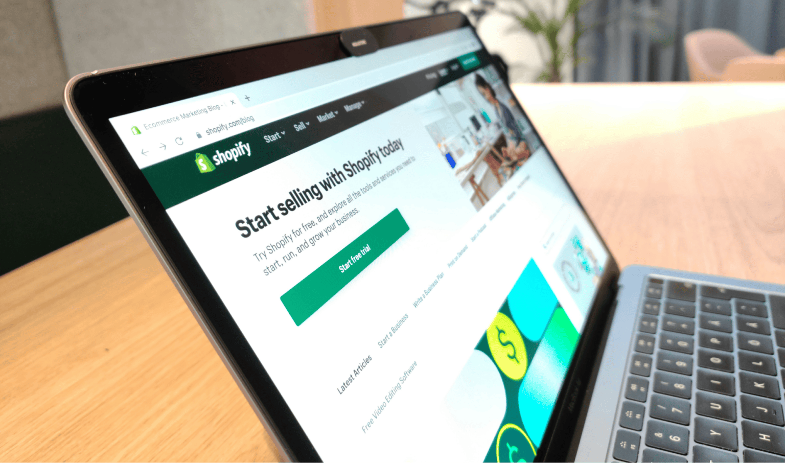 Laptop displaying Shopify start selling page, showcasing web design services in Hull, Yorkshire, for businesses seeking professional website development and marketing solutions.