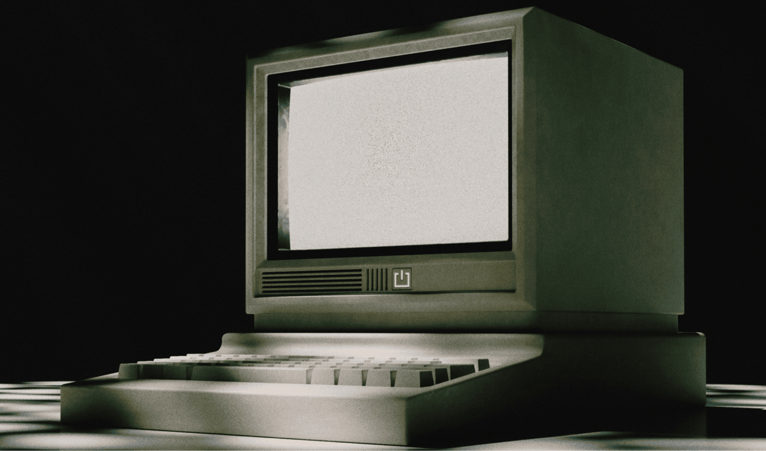 Old computer monitor with a blank white screen, vintage style, on a dark background, representing early technology and digital history.